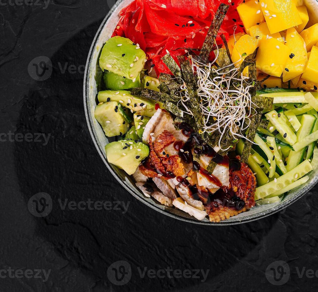Fresh poke bowl on dark background photo