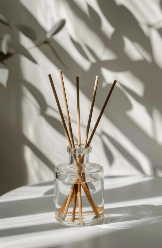 Glass Vase With Reeds on Table photo
