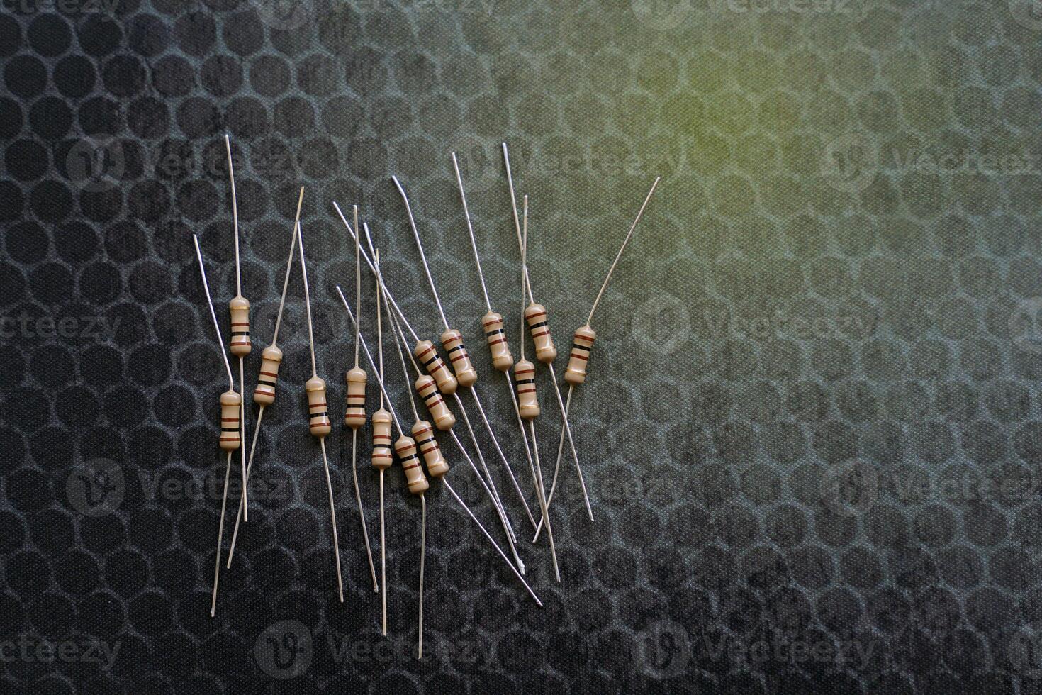 Resistors are electronic devices that control the amount of current and voltage between two points in a circuit. Soft and selective focus. photo