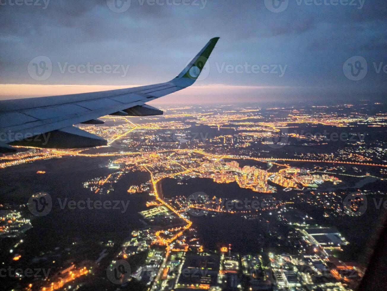 A snapshot of the city at night from the height of the plane's flight photo