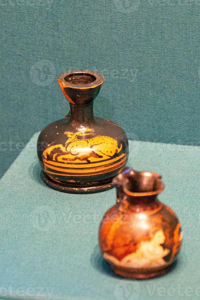Antique ceramic decorative amphora on a white background photo