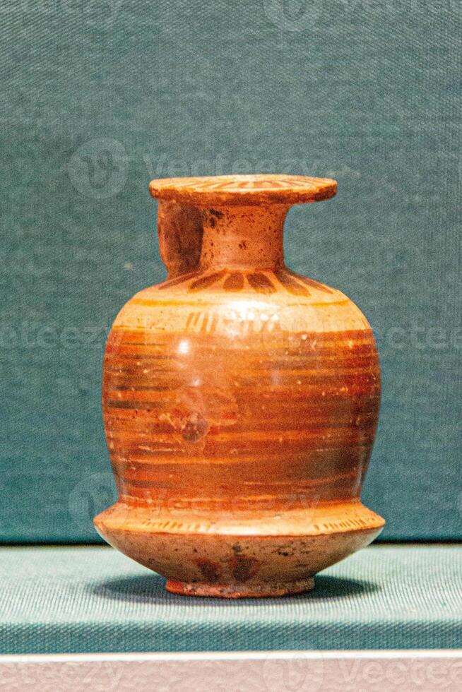 Antique ceramic decorative amphora on a white background photo