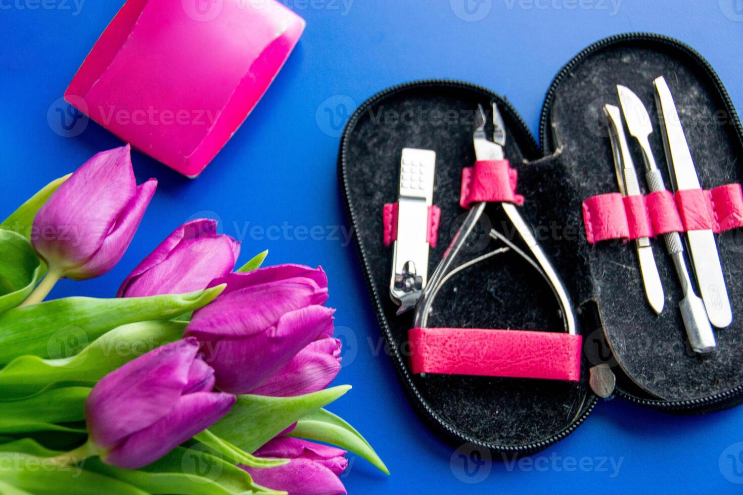 Tools and cosmetics needed for nail styling on a white background. photo