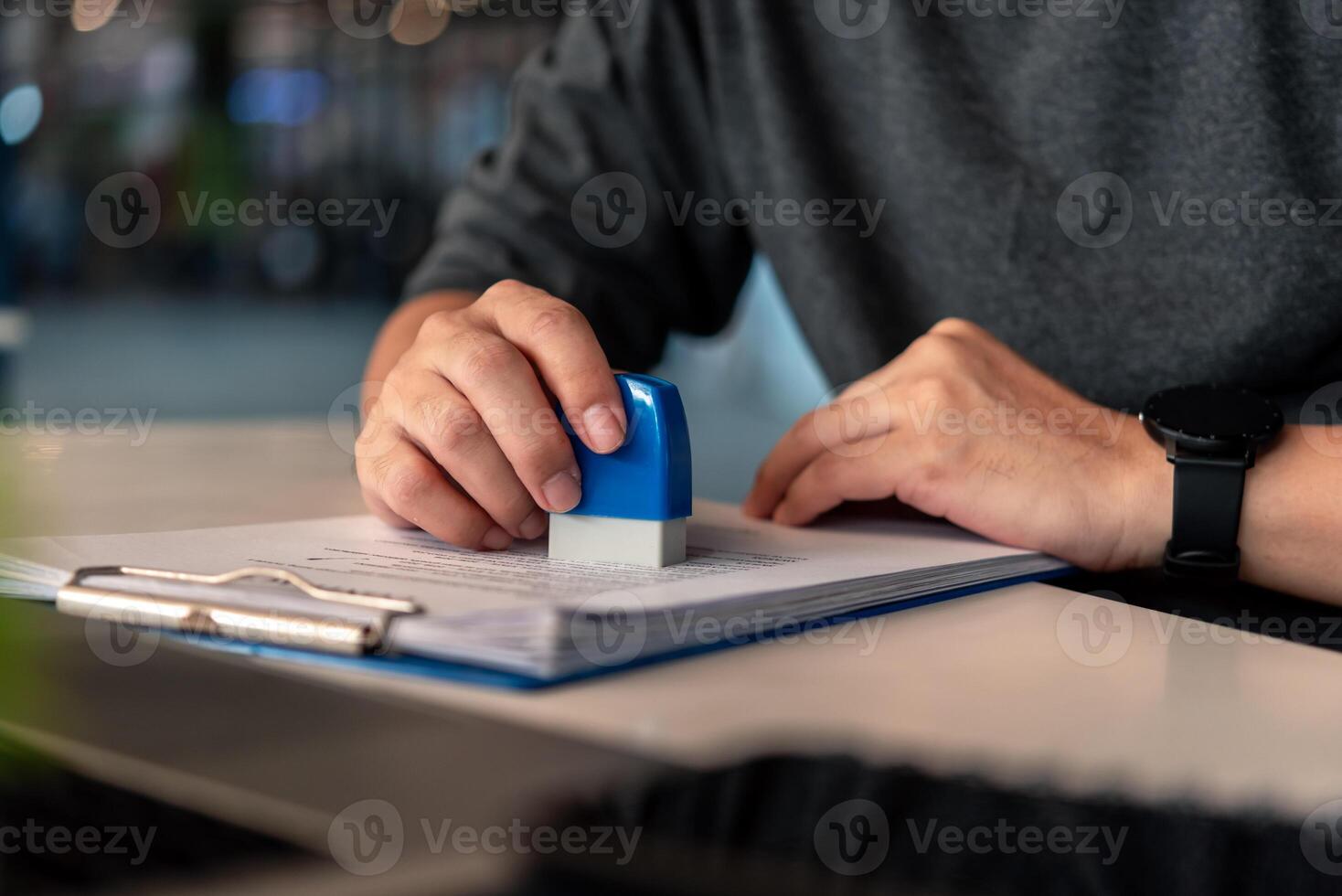 Contract law or paper work business and finance document rubber stamp. For official and legal contracts and agreements, financial statements, investment contracts, real estate documents. photo