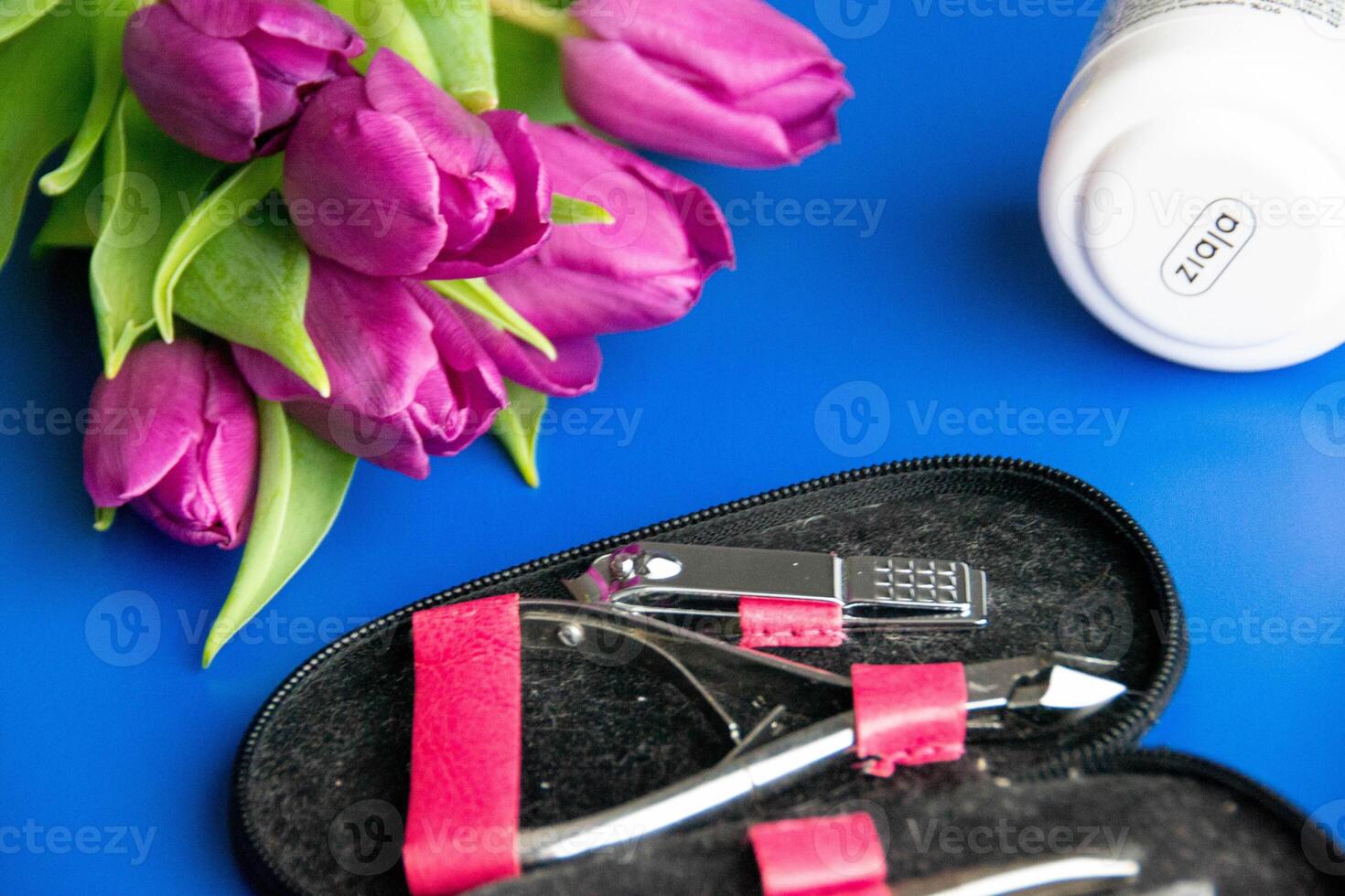 Tools and cosmetics needed for nail styling on a white background. photo