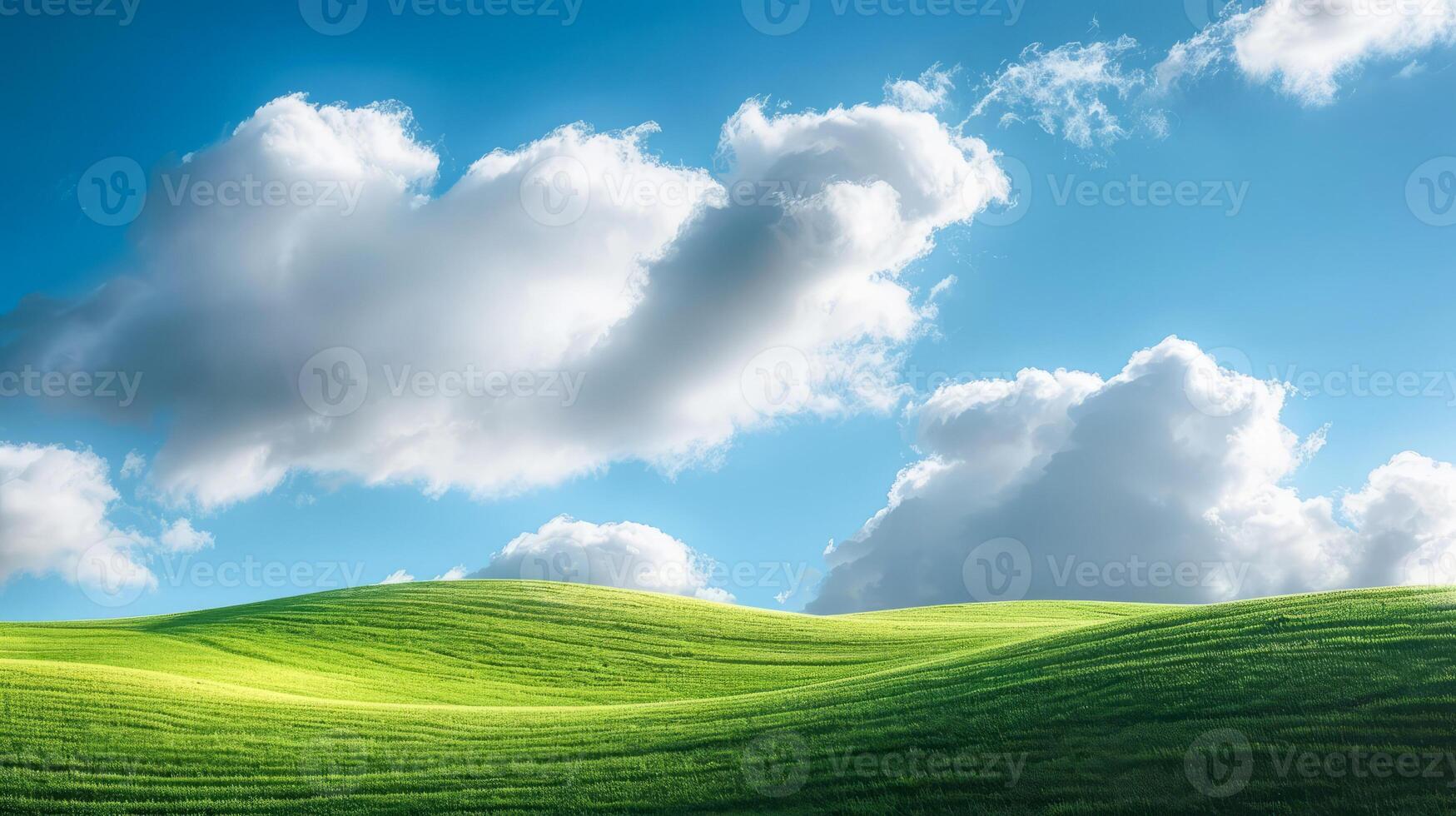 Landscape with clouds resting on a green hillside in sunlight. photo