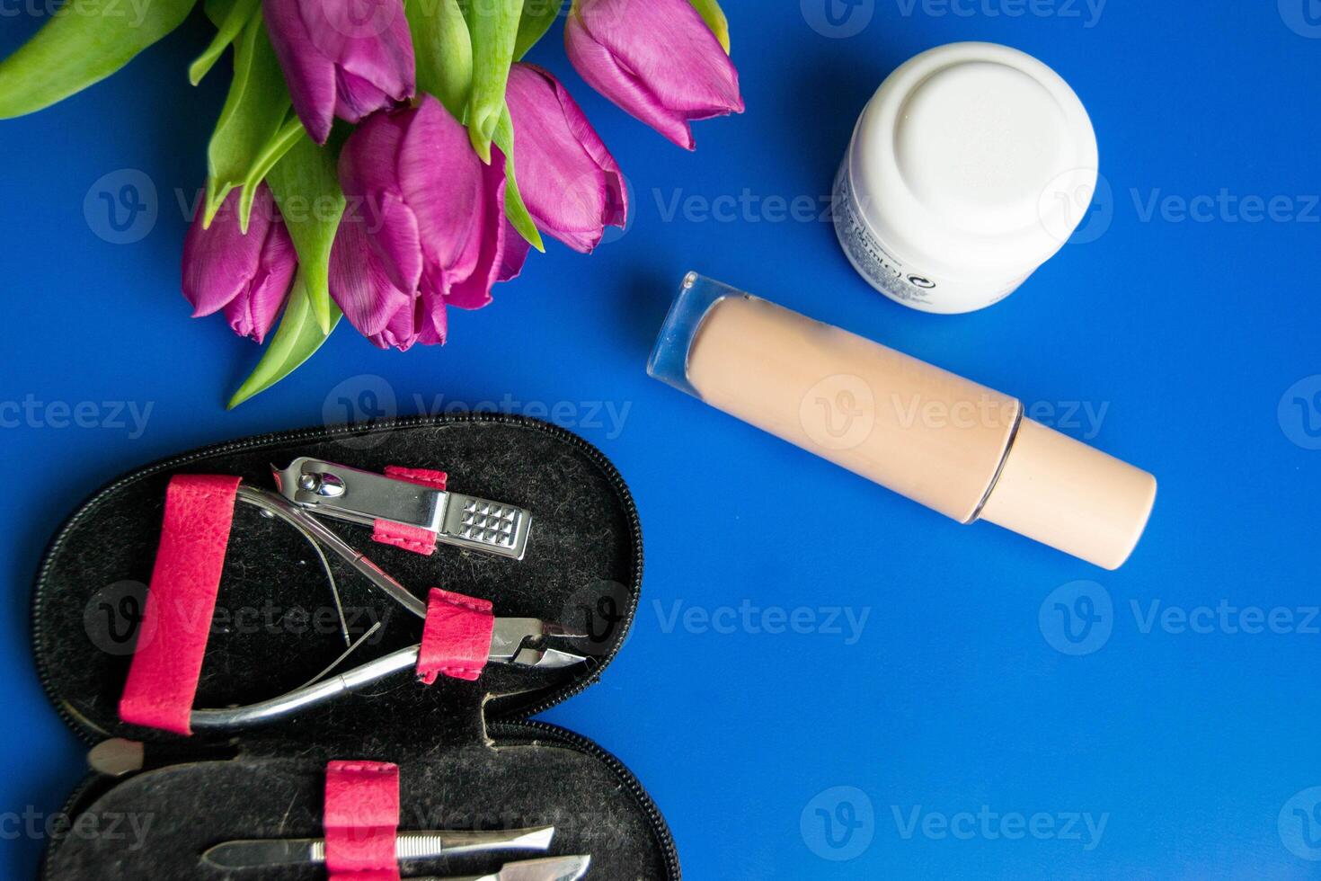 Tools and cosmetics needed for nail styling on a white background. photo