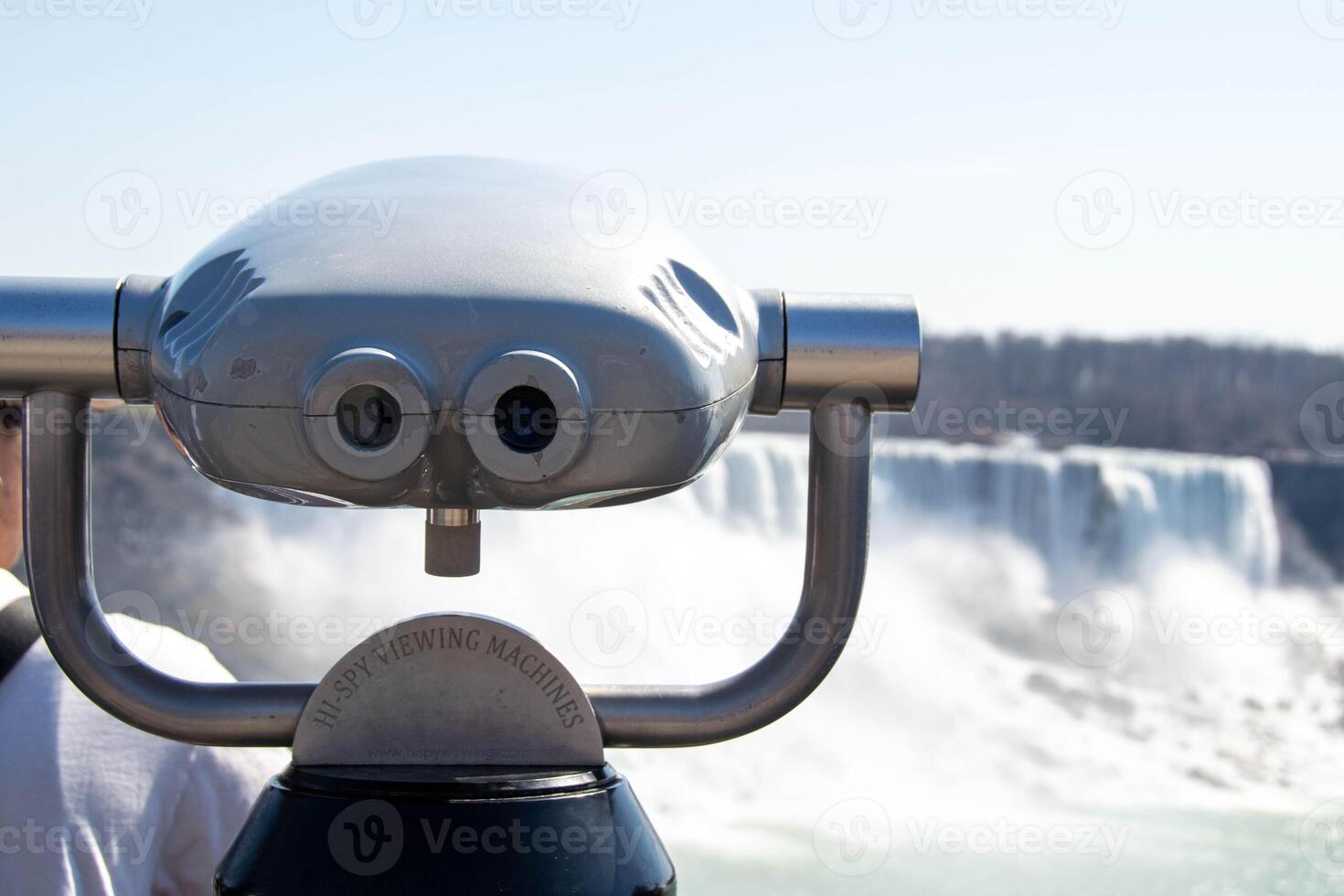 Observation binoculars close-up with a view of the river photo