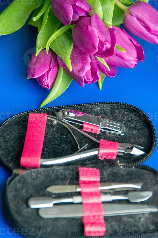 Tools and cosmetics needed for nail styling on a white background. photo