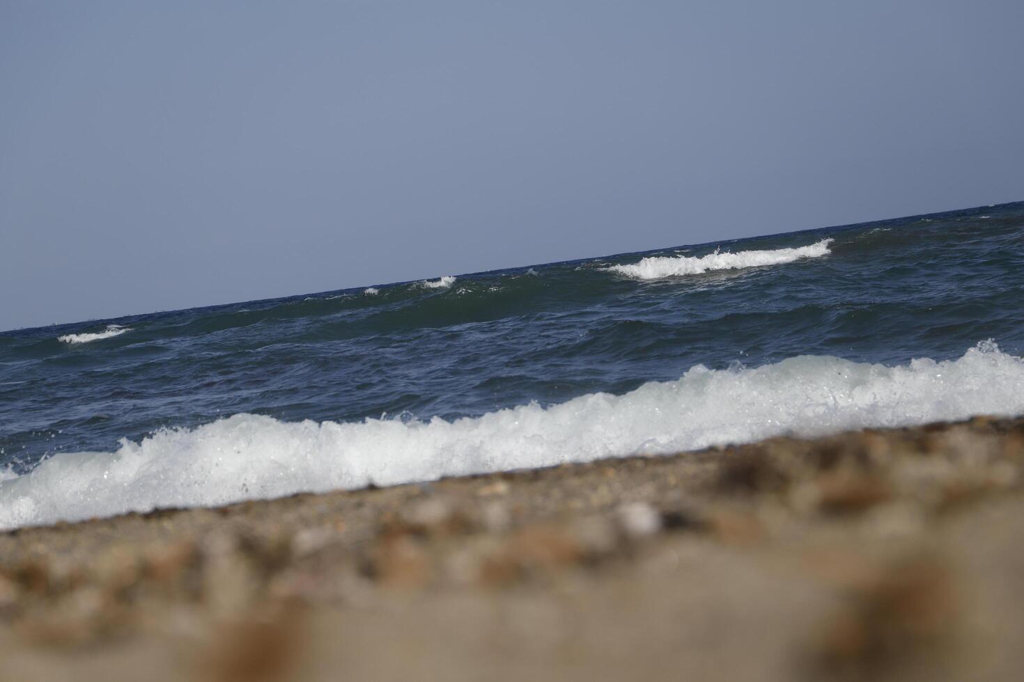 rough sea with many waves, no straight horizon, it feels like you are swaying on the waves photo