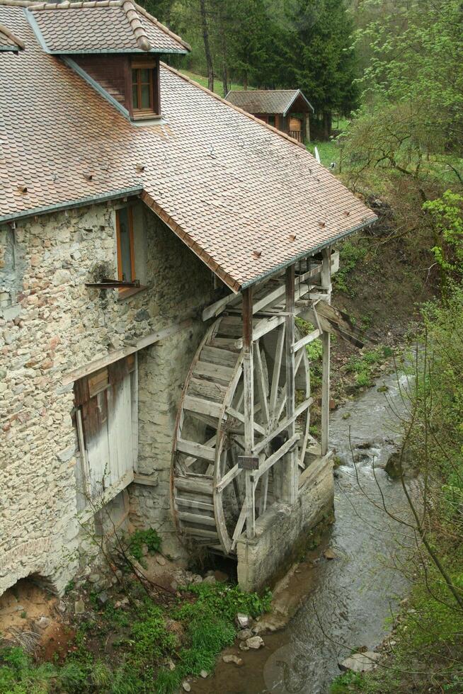 old water mill in a river in france photo