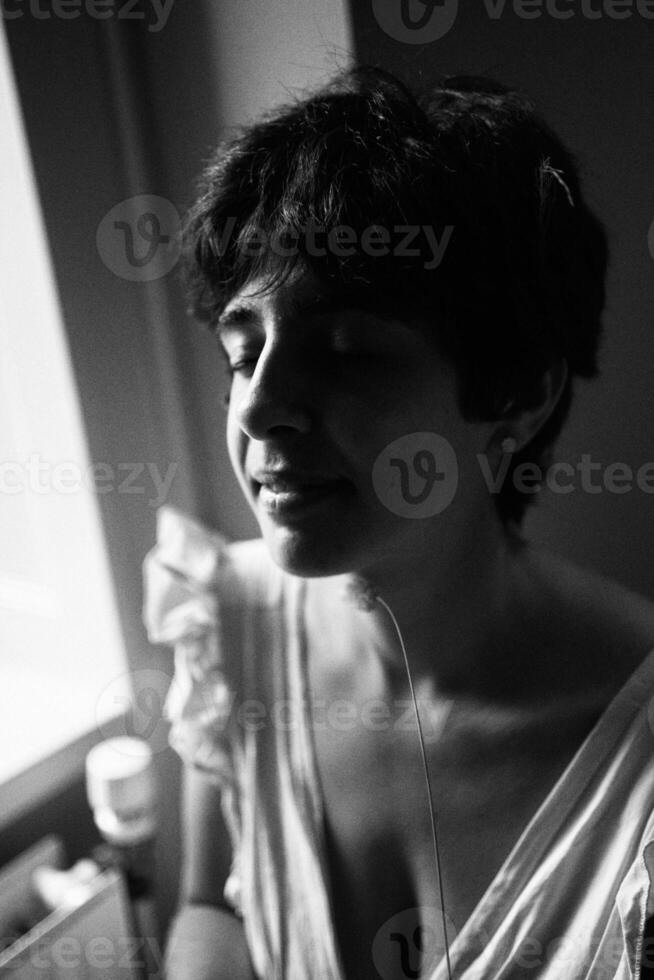 a girl with a short haircut in a restaurant, black and white photo in vintage style