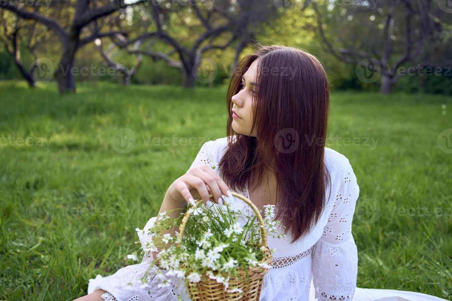 a portrait of a teenage girl in a pastel dress on a picnic photo