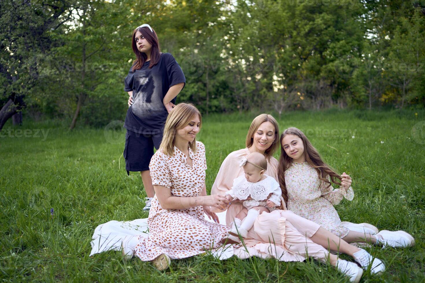 girls' picnic, everyone in pastel dresses except for a teenage girl in black, who was forcibly dragged to the picnic photo