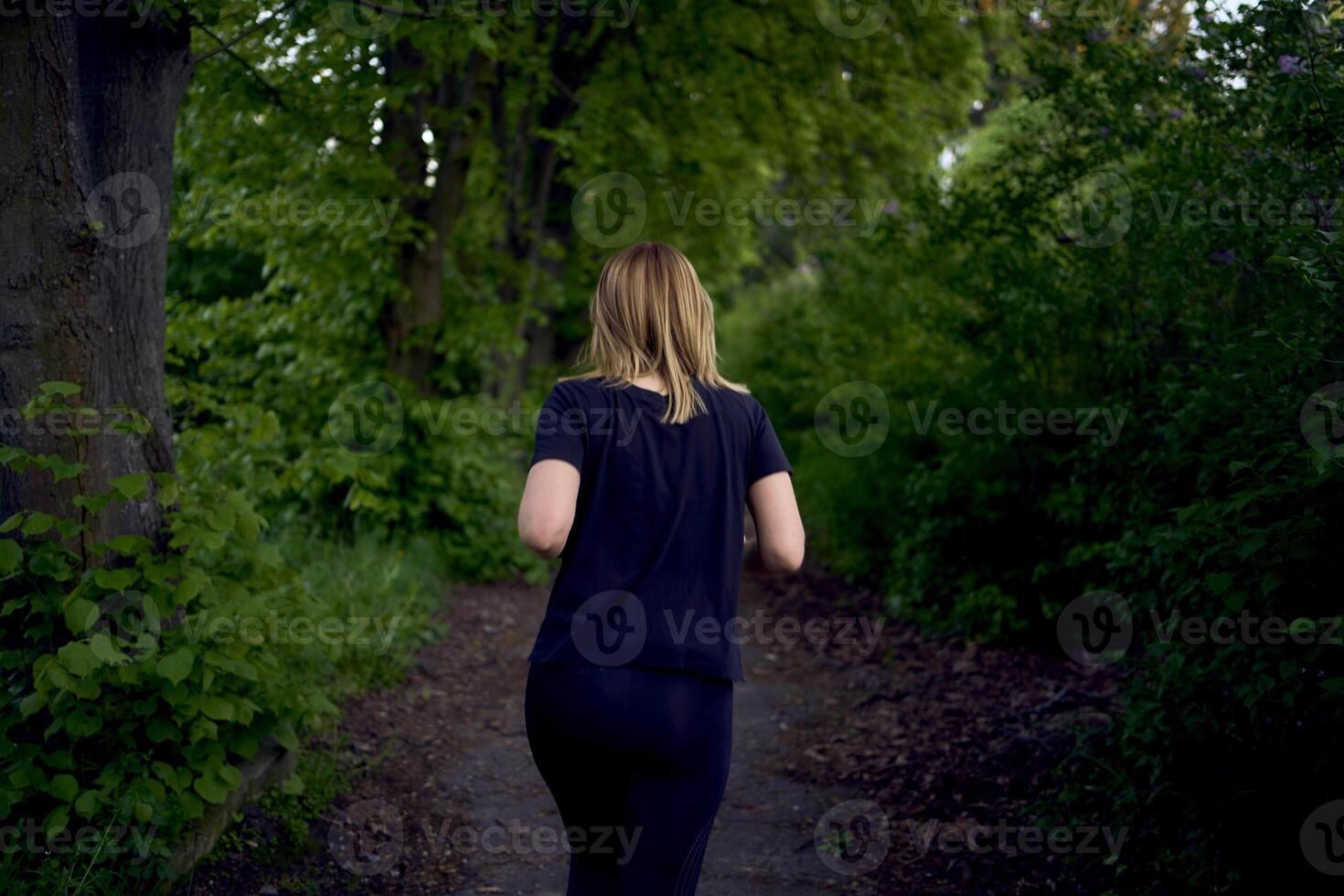 woman runs in the park photo