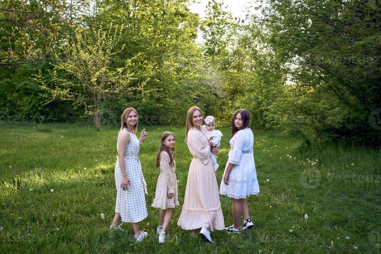 family portrait of two women and their three children photo