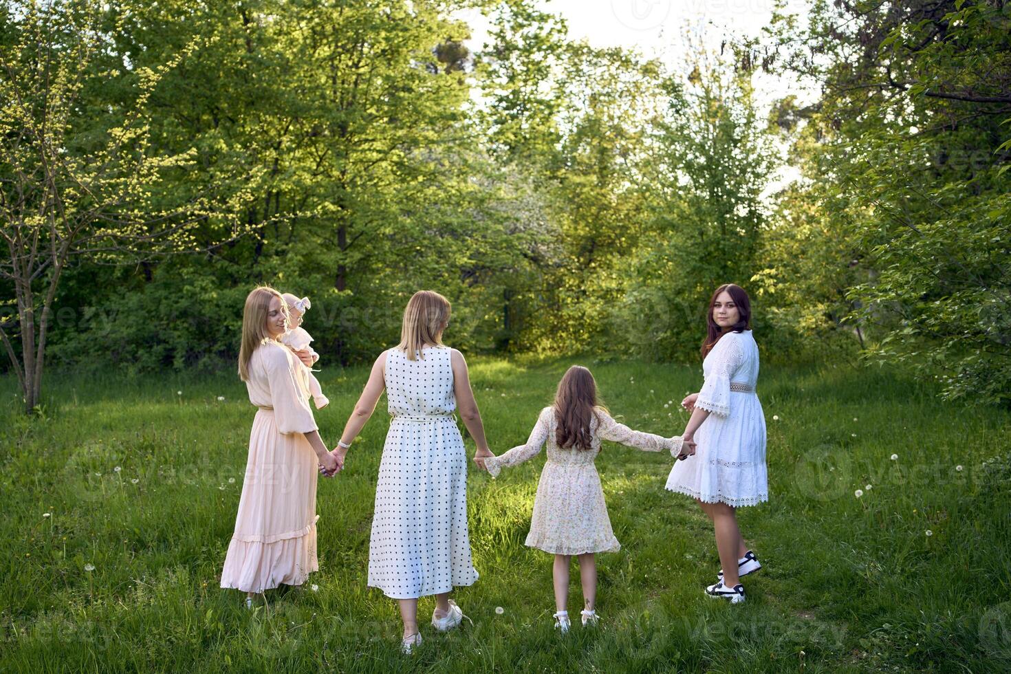 family portrait of two women and their three children photo