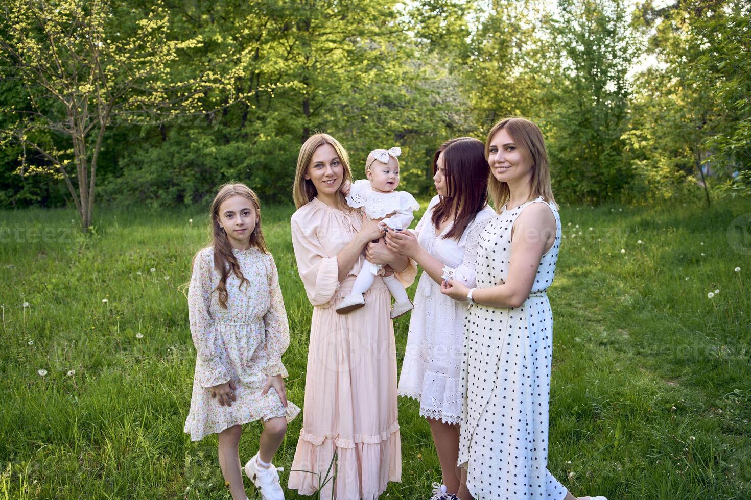 family portrait of two women and their three children photo
