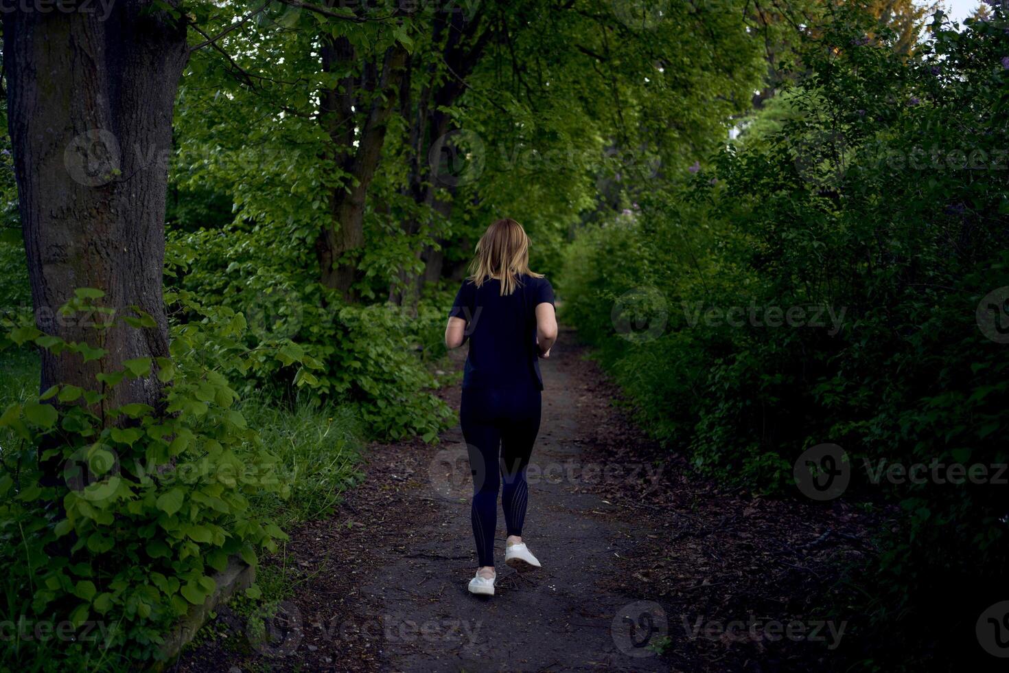 woman runs in the park photo