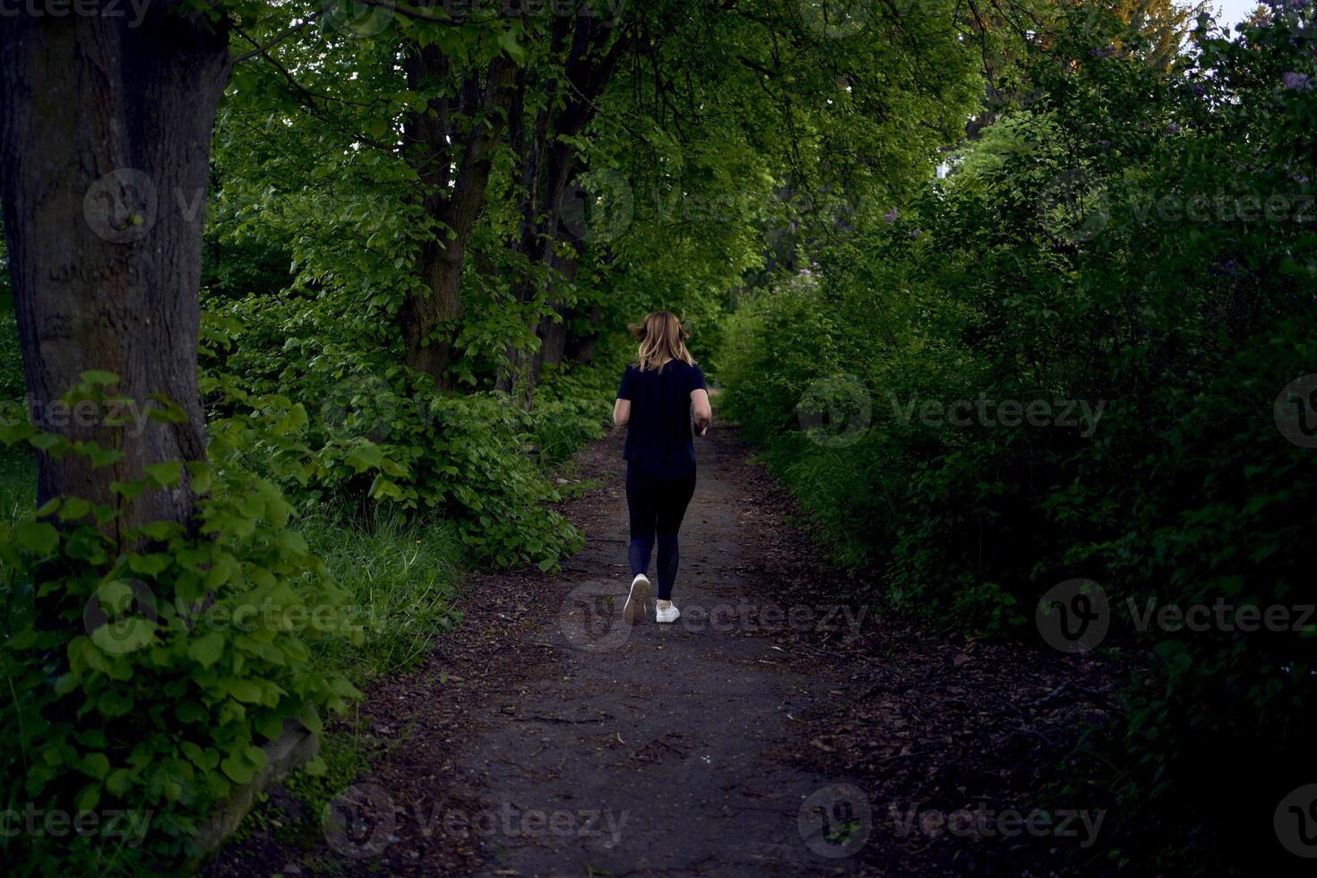 woman runs in the park photo
