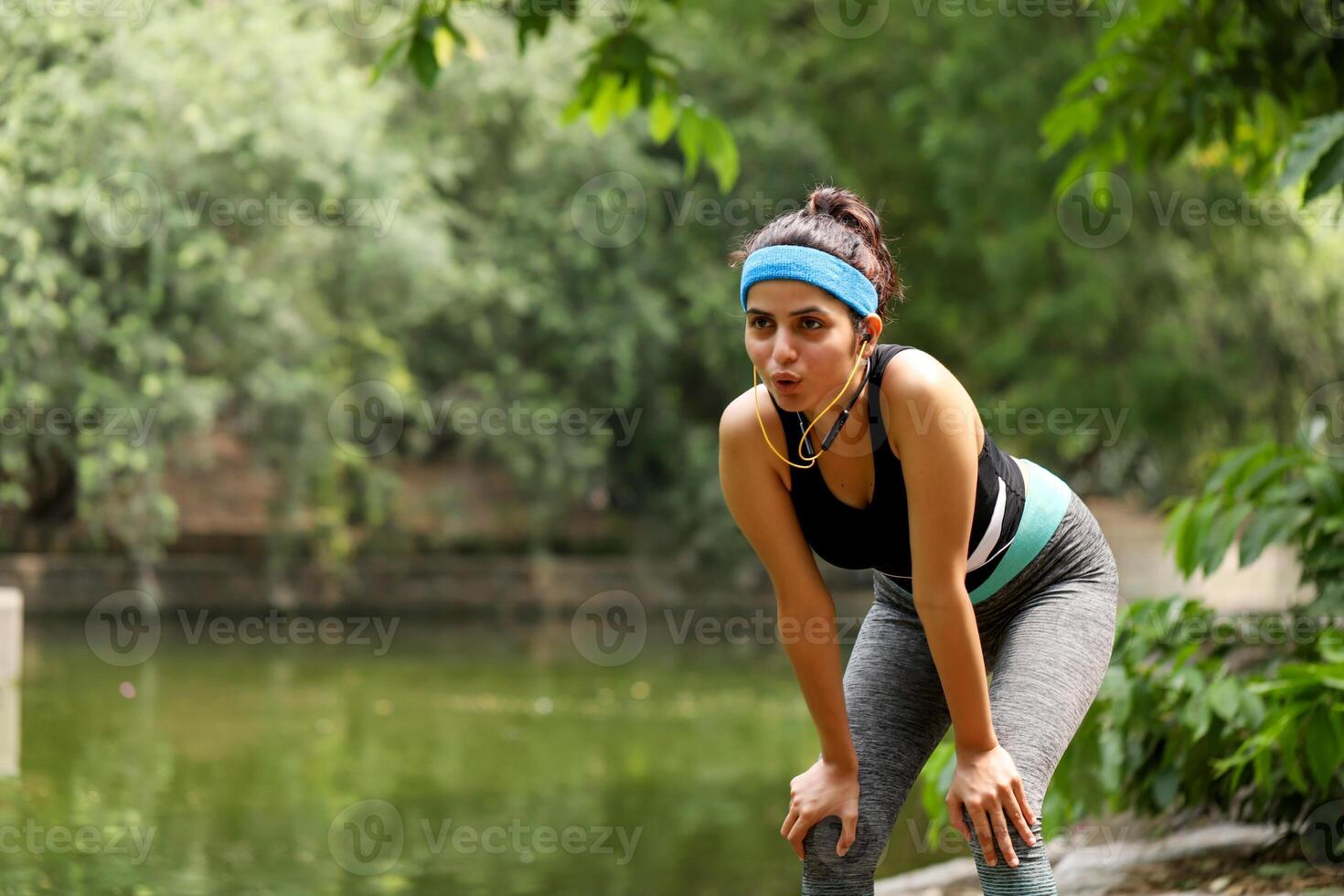 Tired Girl Taking Rest After Running Workout photo