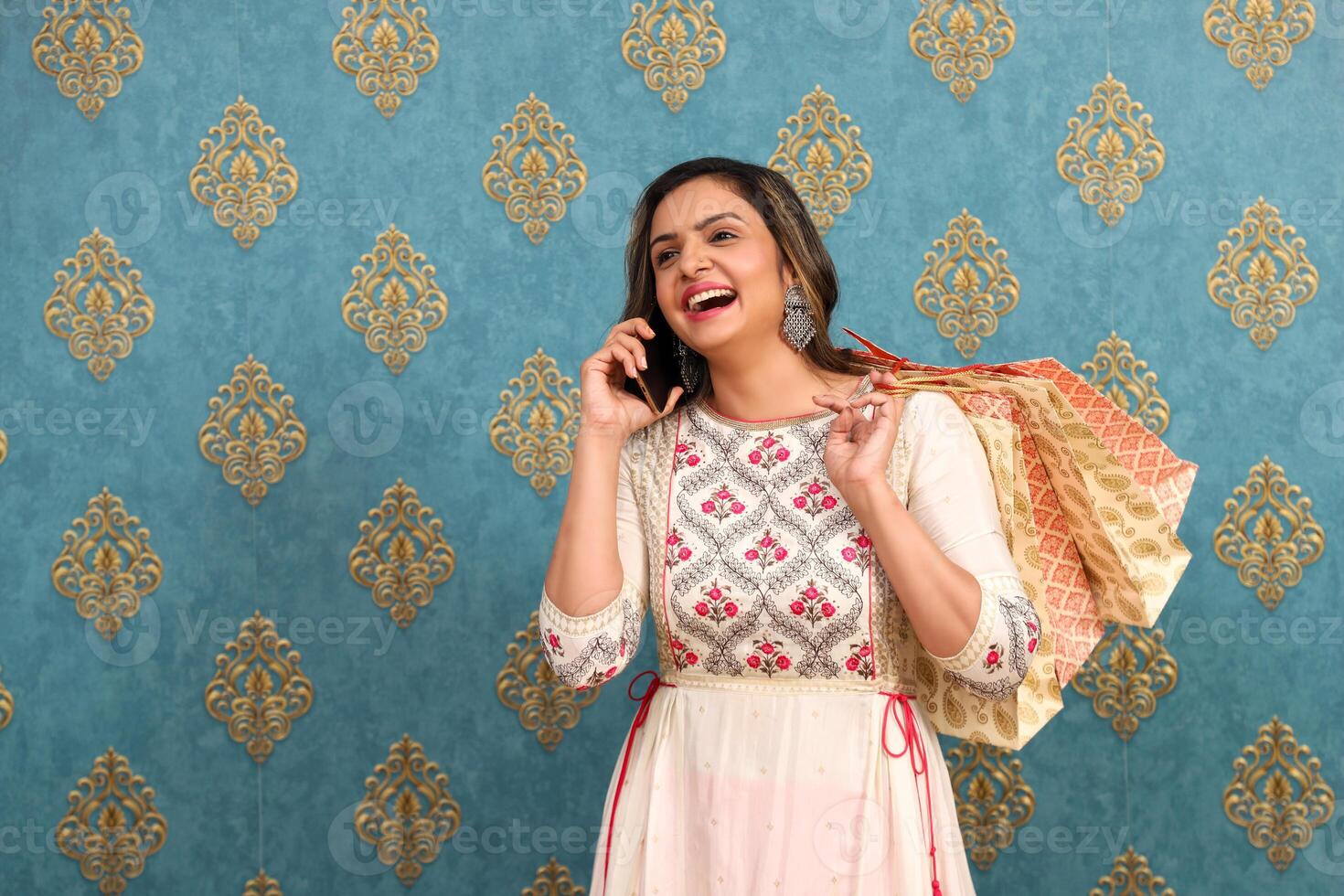 A Young Female Talking On Her Mobile Phone And Laughing photo