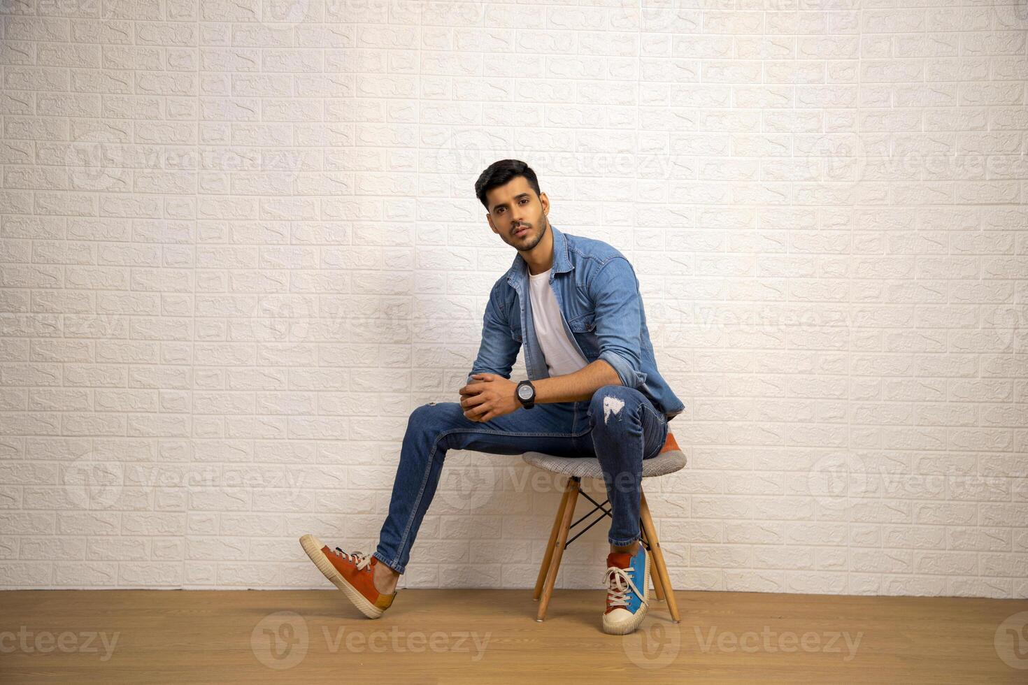 Portrait Of Amazing Guy Posing In Front Of Camera photo