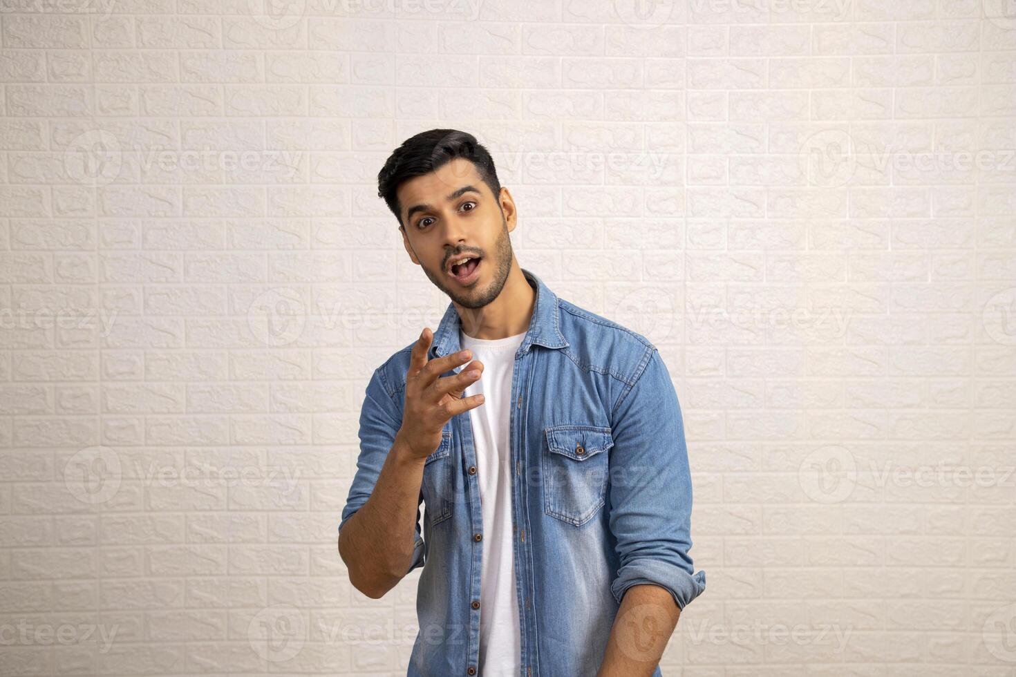 Front View Of Gorgeous Man Pointing Finger To The Camera photo