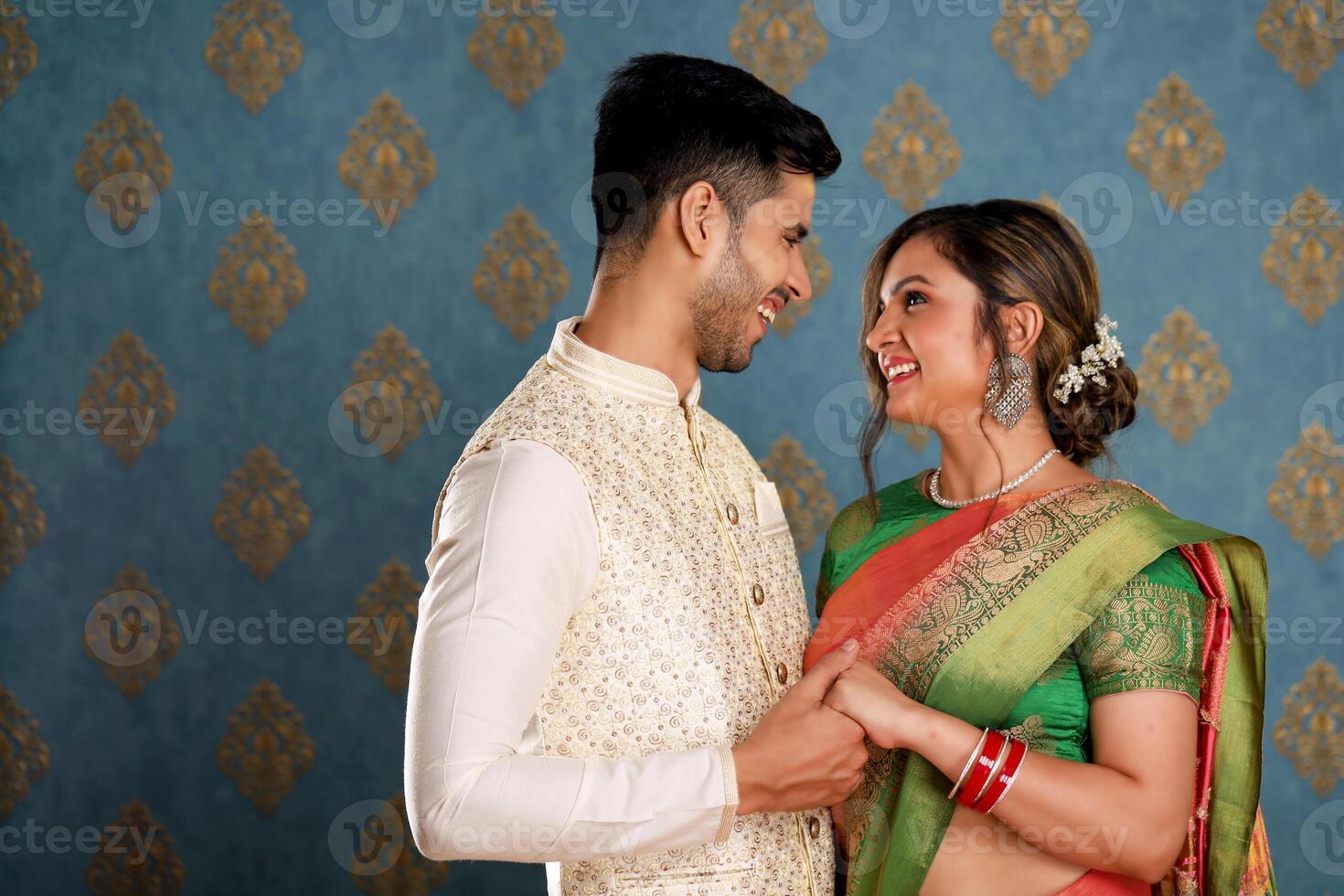 Image Of Young Cute Couple In Traditional Indian Outfit Celebrating Karwa Chauth Festival photo