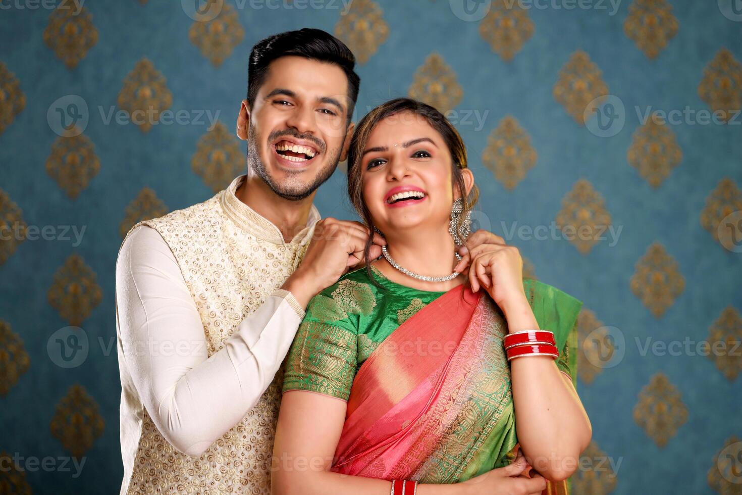 Happy Cute Couple In Indian Traditional Outfit Posing For Camera photo