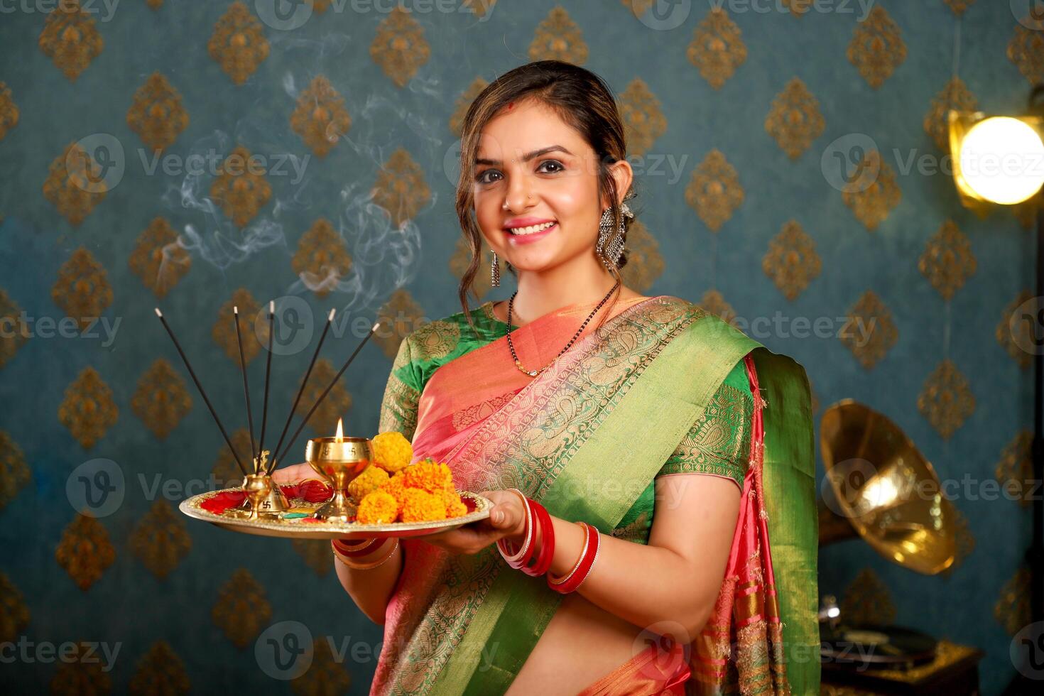 Asian Cute Model In Saree Holding Pooja Plate photo