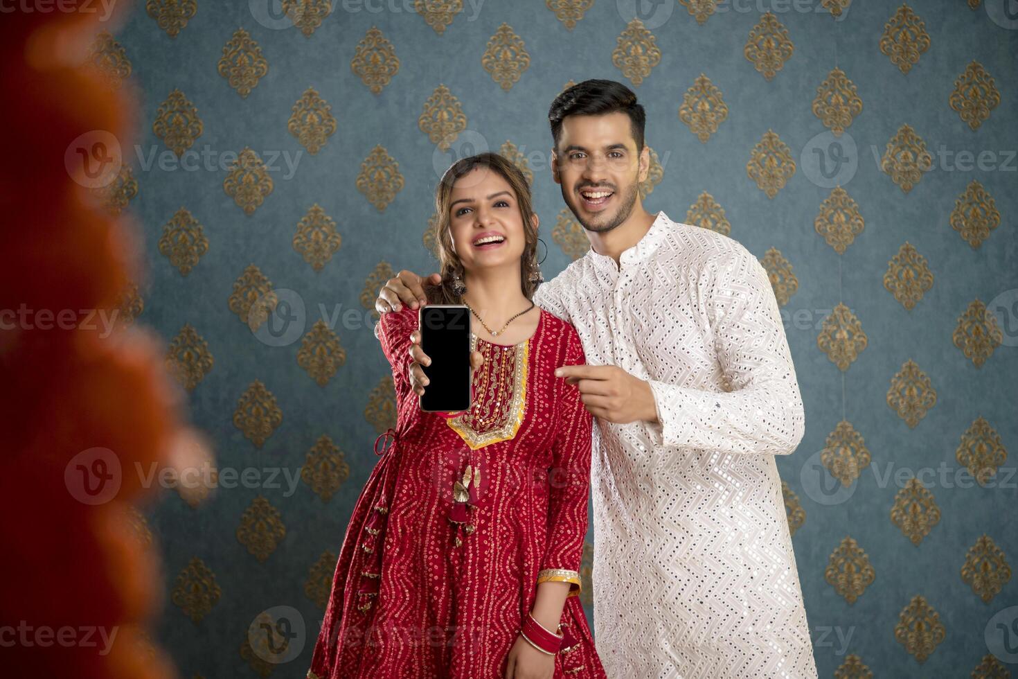 Handsome Indian Man Smiling While Turning Back While Holding Book In Hand photo