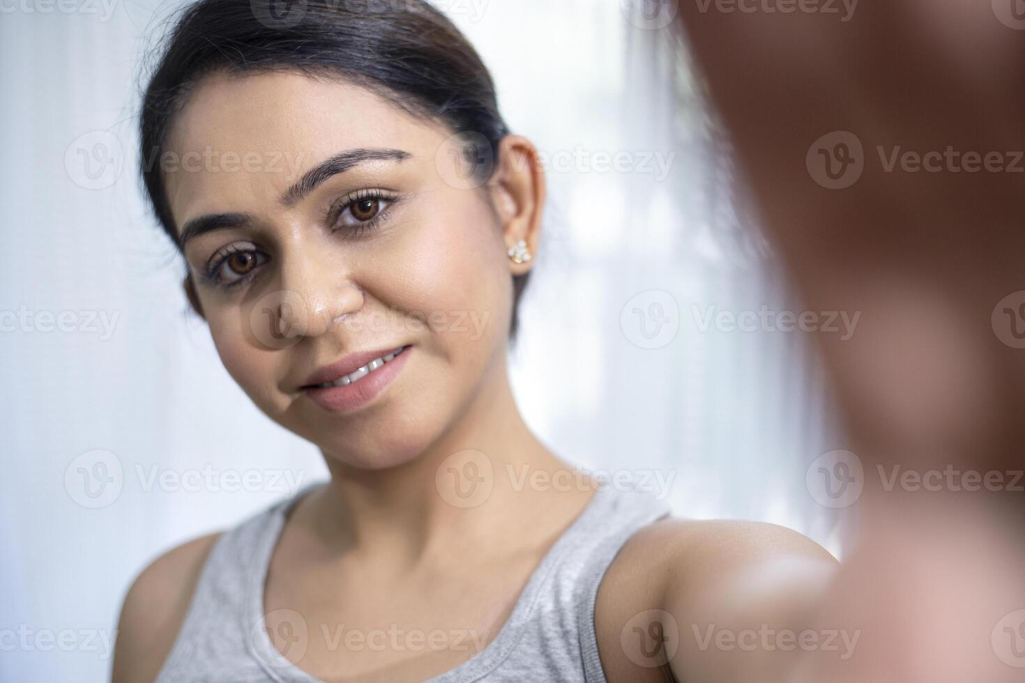 Smiling Woman Taking Selfie photo