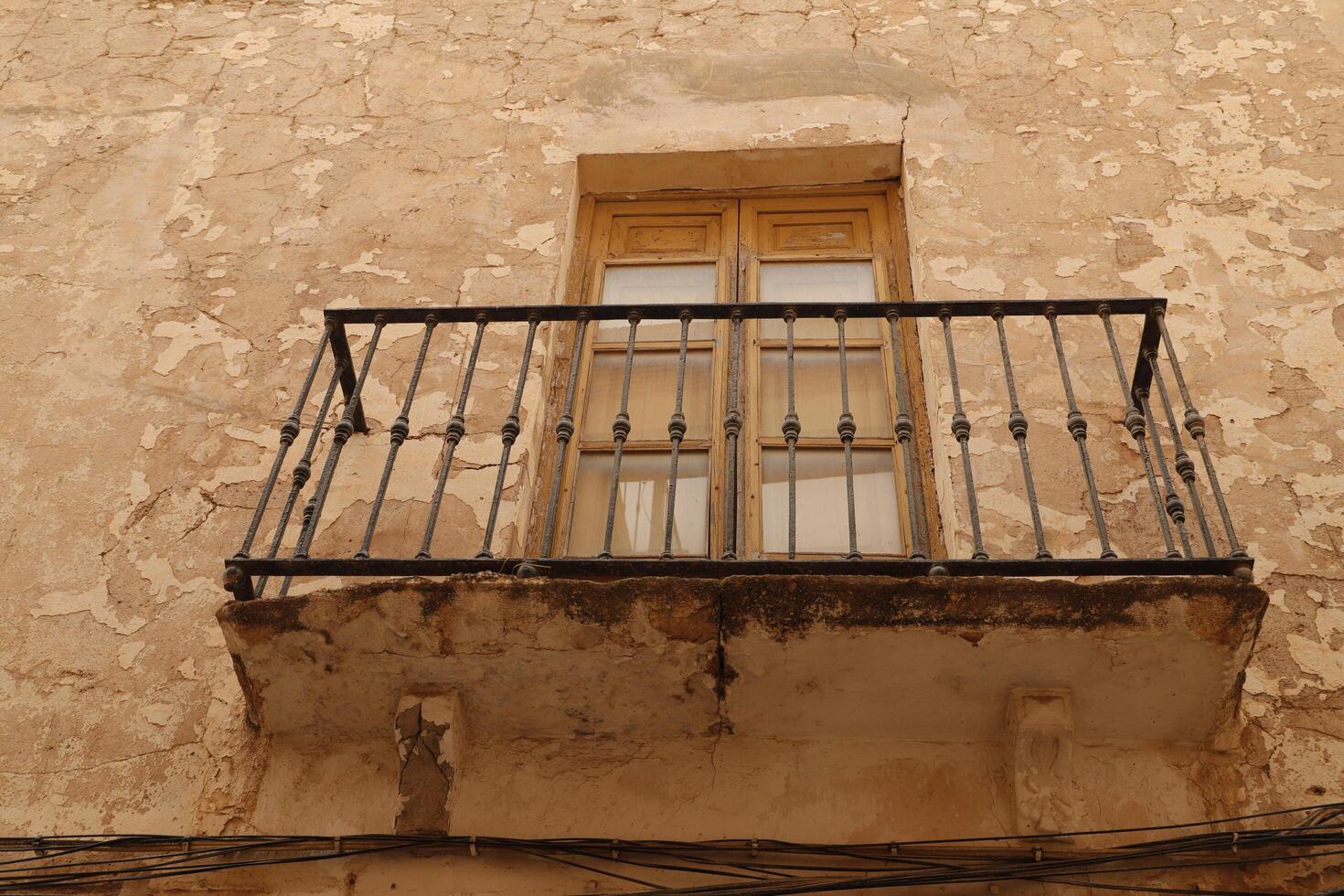 old doors with balcony, spain photo