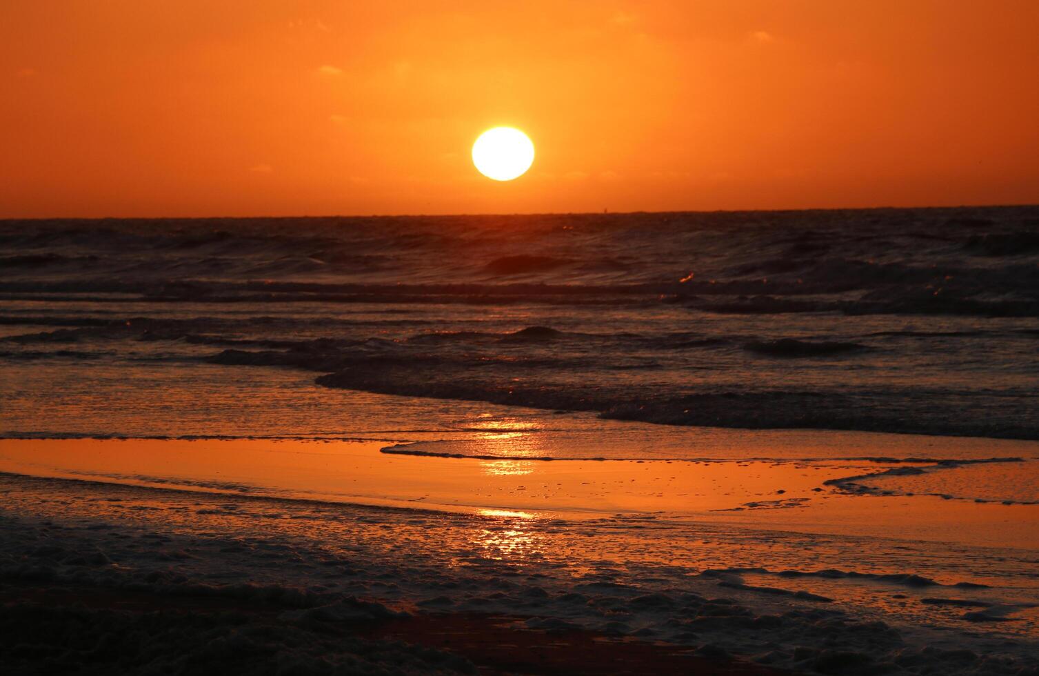 sunset at vlieland, dutch island in the sea photo