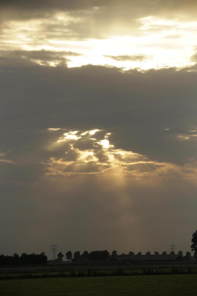 sunset in the netherlands, clouds, colors photo