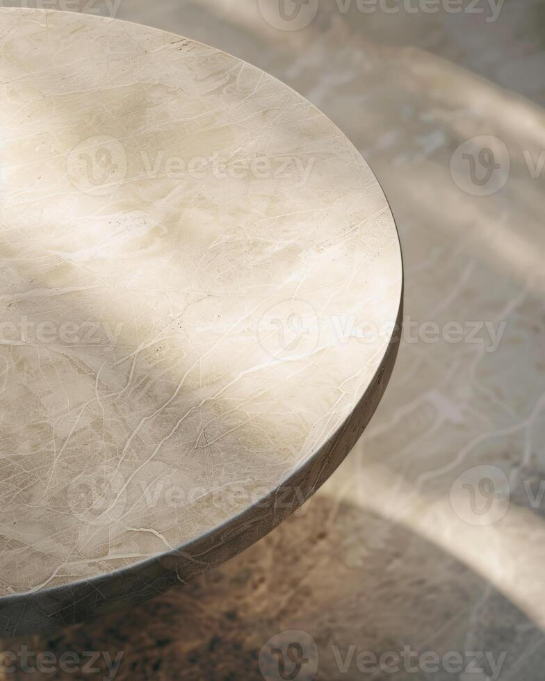 An image of a round marble table with a smooth surface and sunlight reflecting on it. photo