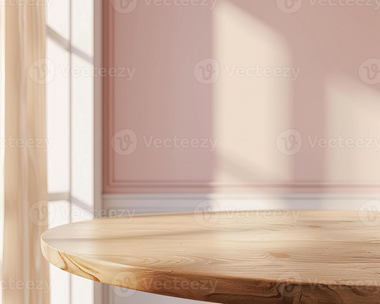 An empty wooden table against a pink wall with sunlight shining through a window. photo