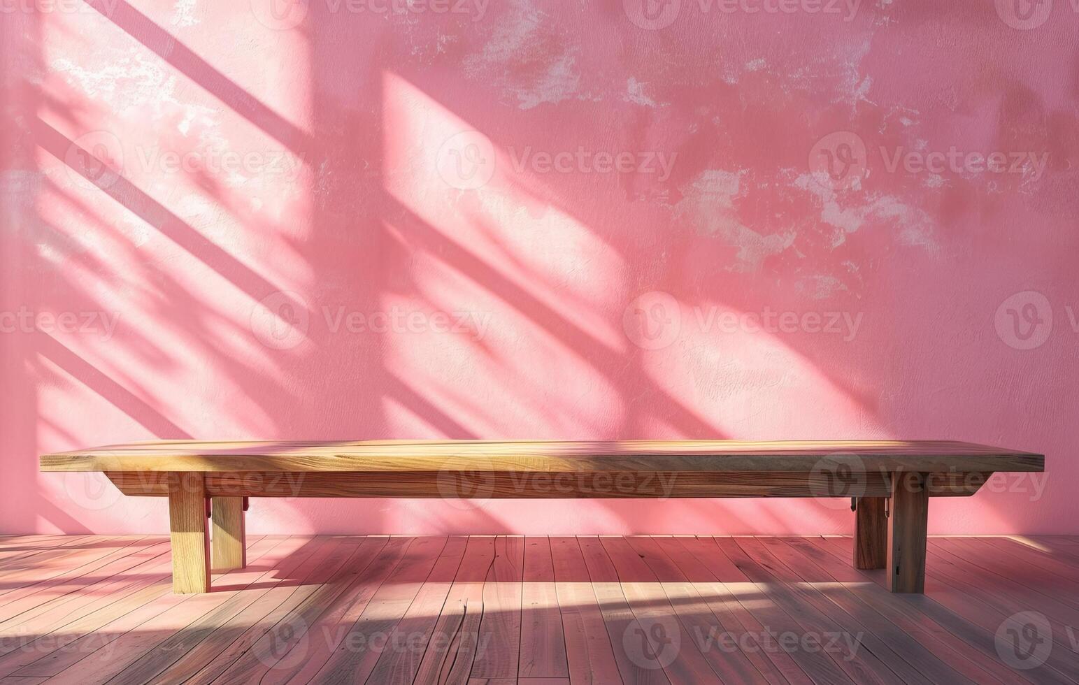 A wooden bench sits in a pink room. The light from the window casts shadows on the wall. photo