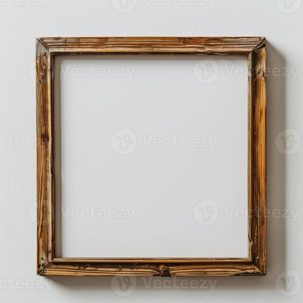 empty wooden frame. It is made of light brown wood and has a simple design. The frame is square and has a white background. photo