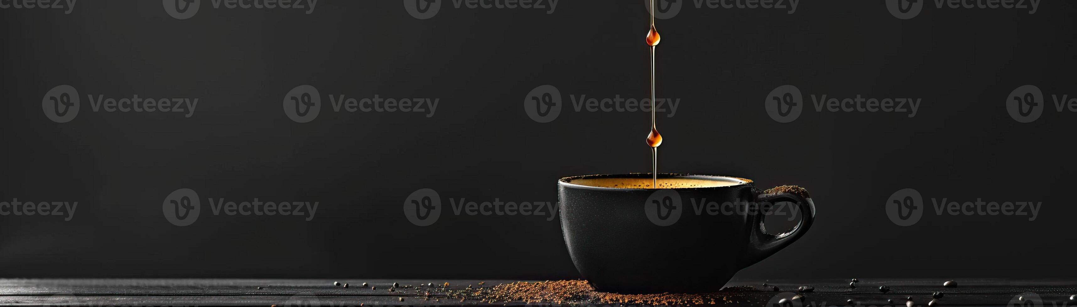 A monochromatic theme with coffee dripping into an elegant black cup, the drips highlighted against a matte black background, broad space on the left for minimalist text. photo