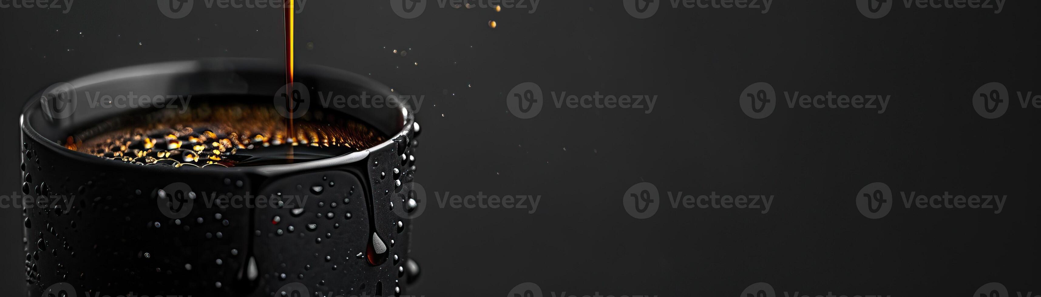A monochromatic theme with coffee dripping into an elegant black cup, the drips highlighted against a matte black background, broad space on the left for minimalist text. photo
