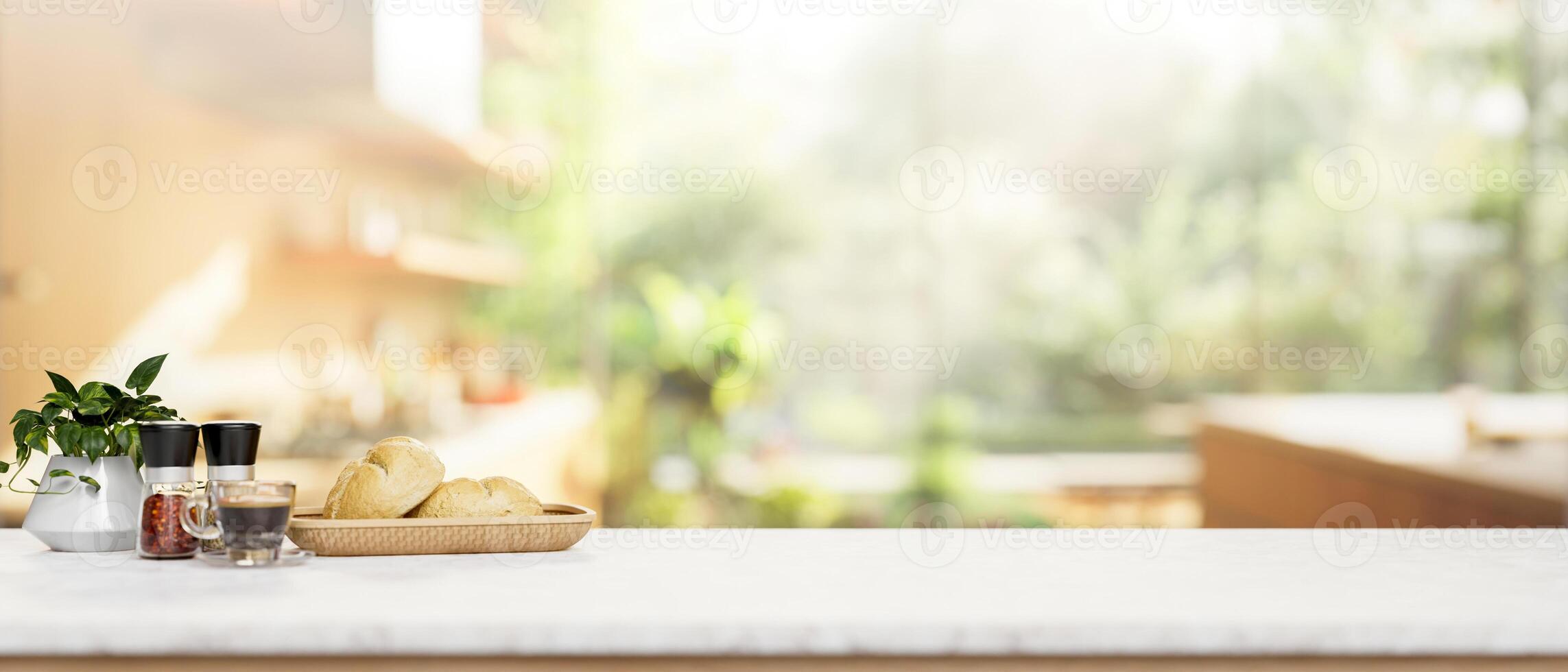 A white kitchen tabletop with a blurred background of a contemporary bright kitchen. photo