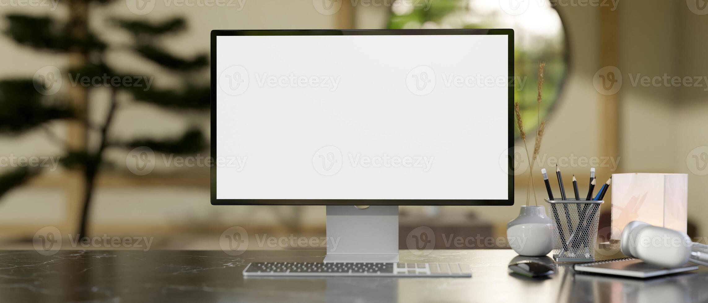 A modern Zen Japanese home office features a computer mockup and accessories arranged on a table. photo