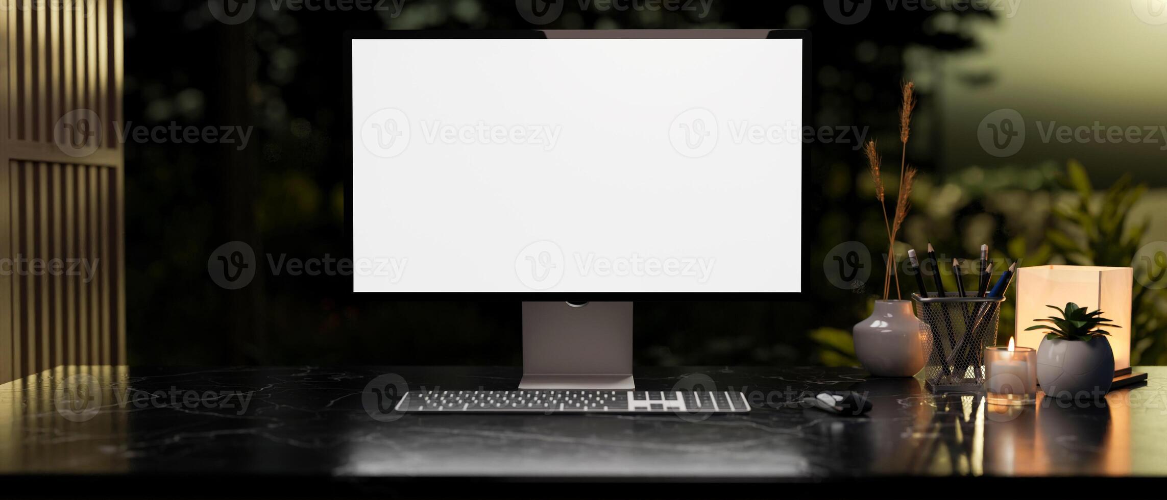 Modern dark workspace with a white-screen computer mockup and accessories arranged on a table. photo