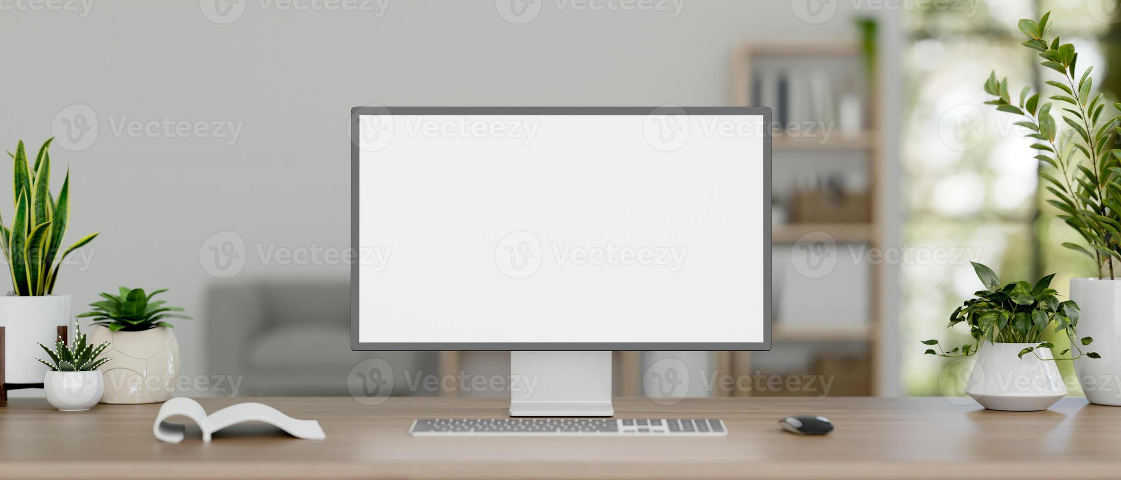 A desktop computer mockup and decor plants on a wooden desk in a minimal white office room. photo