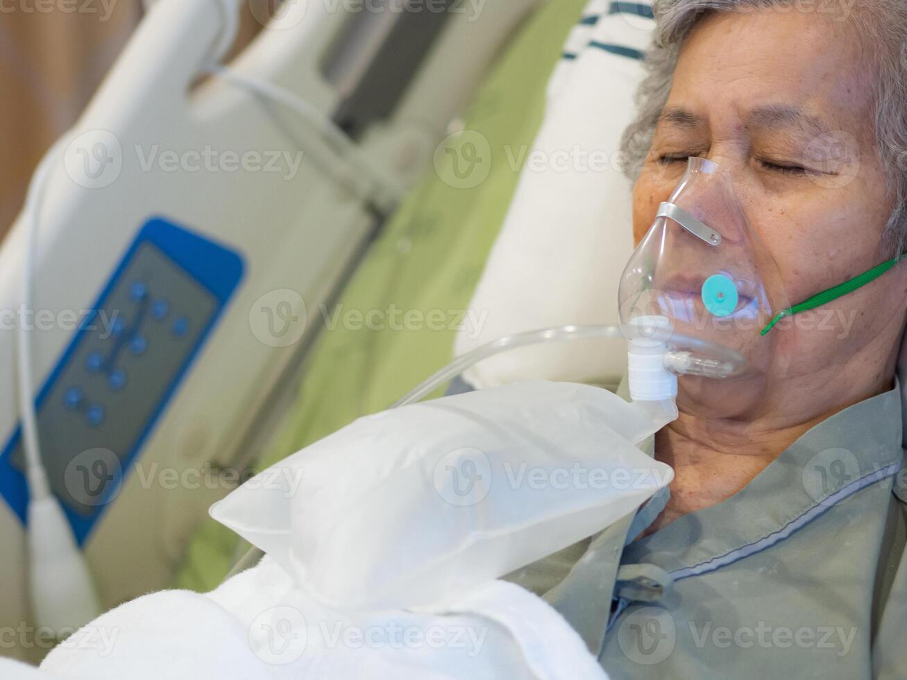 Elderly woman patients with lung disease, getting oxygen for treatment in the room at the hospital. Space for text. Concept of aged people and healthcare photo