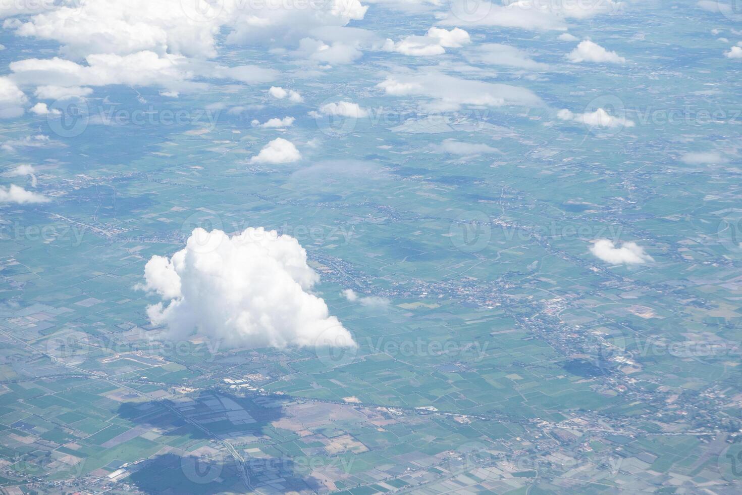 Beautiful view from airplane window above the clouds. Bright blue sky and white clouds. Skyline background with copy space. photo