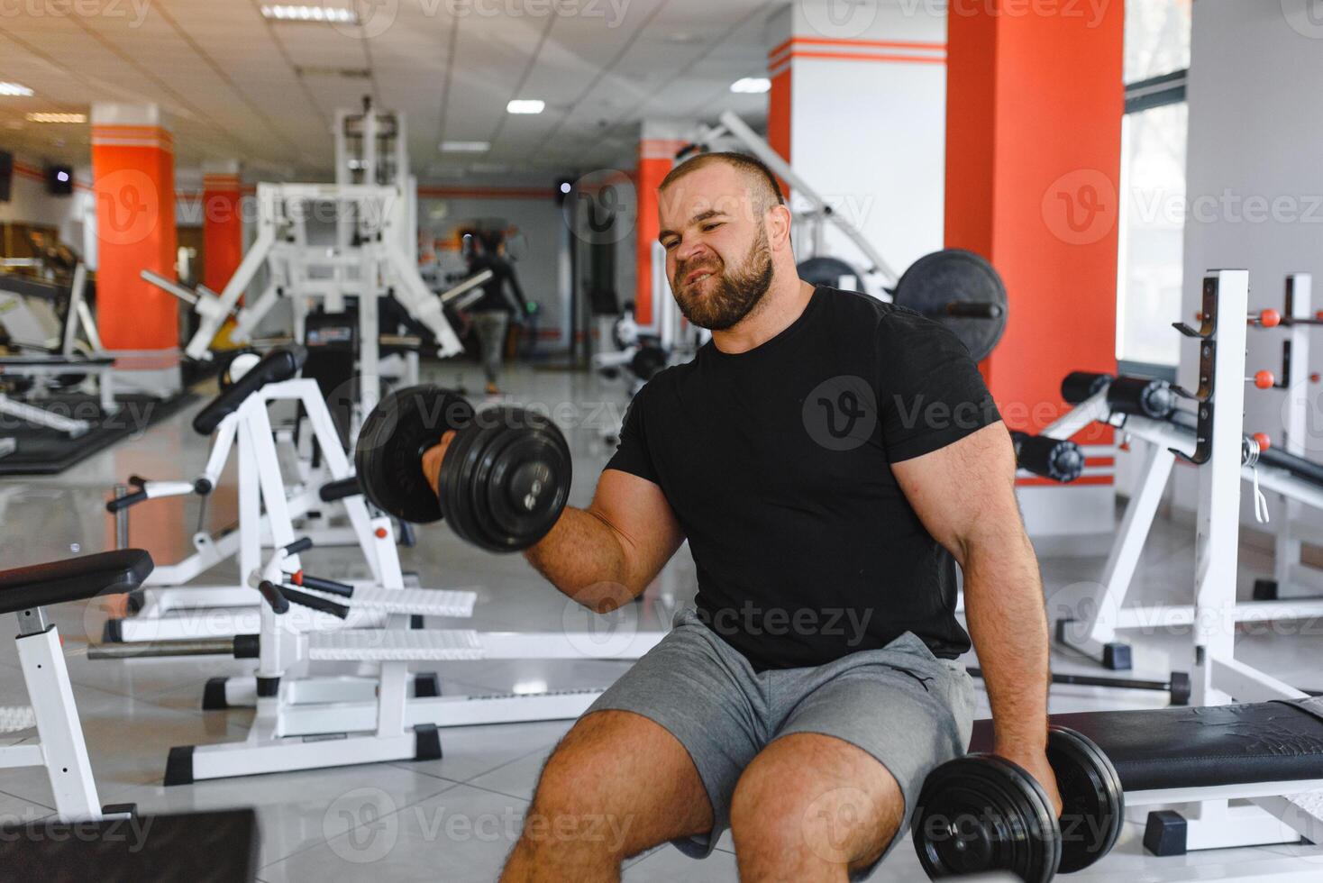 Young handsome man engaged in the gym. photo