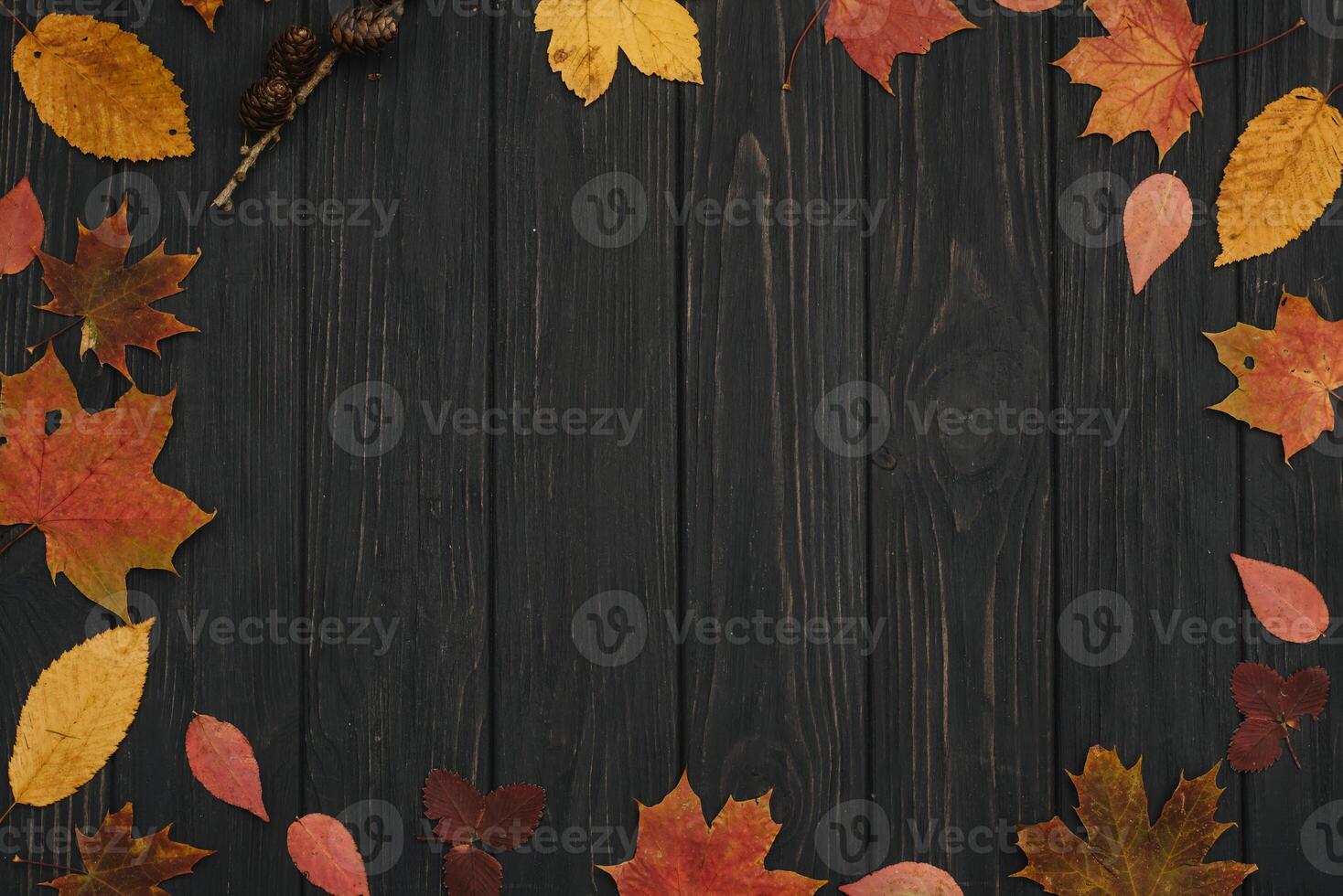 Background texture with old wooden table and yellow autumnal leaves. Autumn maple leaves on wooden background with copy space. Top view. photo